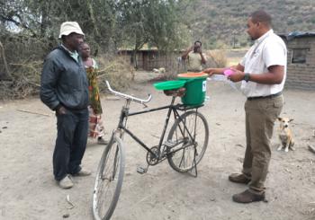 Placed on the back of a bicycle, one of the water filters we gave away. Photo by Matt Norton